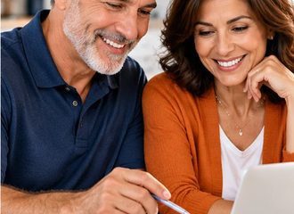Business owners reviewing financial plans and documents together